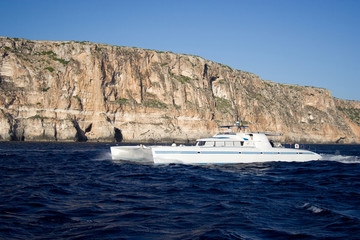 The motor catamaran cruise on the sea.