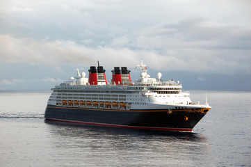 Cruise ship making ocean passage with overcast sky