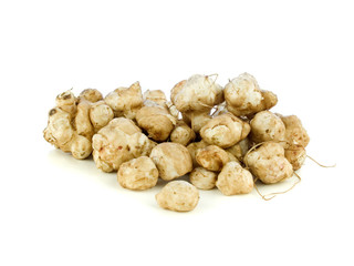 Garden fresh jerusalem artichokes isolated on white