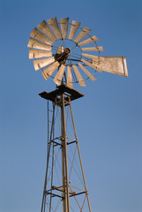 Windmill against blue sky.