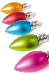 A row of colorful Christmas decorations on a white background