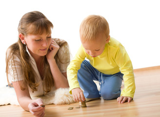 Cute boy with mother learn to count money at home