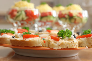 On a photo fish sandwiches on plate