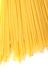 yellow spaghetti on white background with shadows