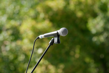 microphone with stanchion on green background