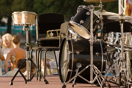 drums set on the scene with people and trees background