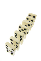 Row of Dominoes on White Background
