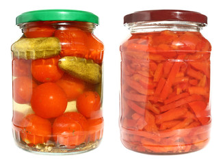 Tinned vegetables in glass bank on a white background.