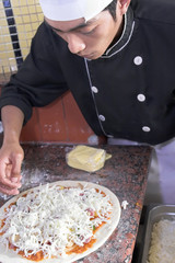 chef cooking pizza