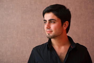 Obraz premium young man portrait close up on grunge wallpaper background