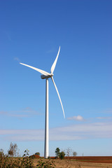 Fototapeta premium wind mill on blue sky during the autumn