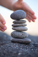 Balanced Stones. Stack of volcanic pebbles on seashore