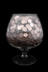 wide glasswith money isolated on black