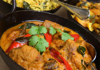 Lamb korma with rice and vegetable curry