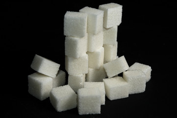 Sugar cubes isolated on black