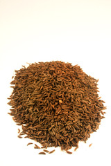 Cumin seeds isolated on white
