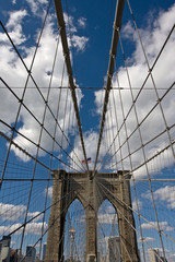 portrait view of brooklyn bridge tower and flag