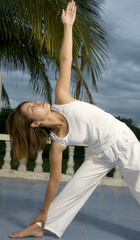 Fototapeta na wymiar Young attractive woman doing Yoga exercise
