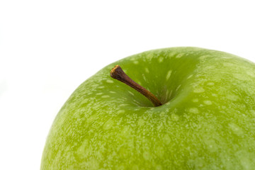 detail of a granny smith  apple isolated on white background