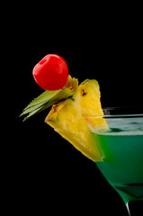 Cocktail drink on fruit/ isolated