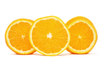 Orange sliced into three pieces standing on white background.