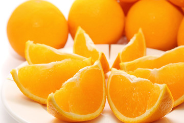 Orange pieces put together with fresh orange.