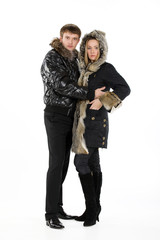 Young woman and man in fur coats