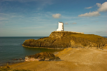 Fototapeta na wymiar Lighthouse and shingle beach.