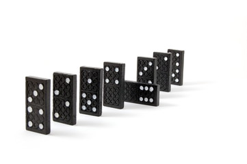 row of dominoes including a special domino stone isolated