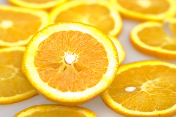 Fresh orange and slices on a white bacground