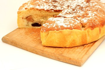 Sliced pie on a traditional wooden plate