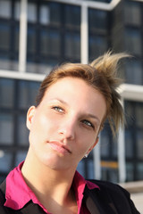 Young pensive businesswoman thinking about her future