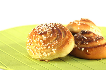 Sweet buns on green isolated on white