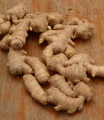 Ginger roots on wooden table