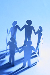 paper team linked together partnership concept