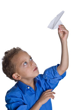 Young Boy Plays With Paper Plane