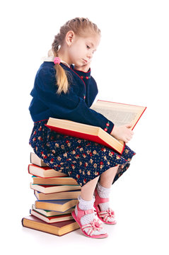 pensive &auml;&aring;&acirc;&icirc;&divide;&ecirc;&agrave; with stack of the books isolated on white