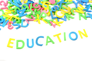 pile of letters and numbers spelling education