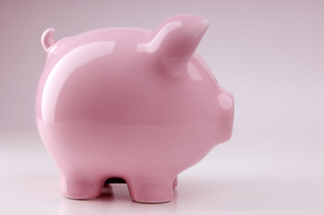 Piggy bank isolated on pink background