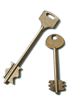 Two gold keys on a white background