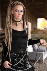 Young woman wearing punk clothing and makeup