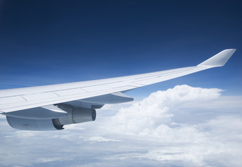 Wing and jet engine of passenger airplane flying