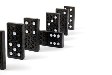 row of dominoes including a special domino stone isolated