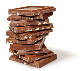 Heap of milk and nuts chocolate, isolated on white background