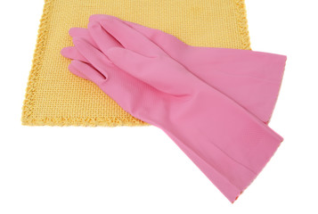 Obraz na płótnie Canvas pink rubber gloves over yellow tablecloth, white background