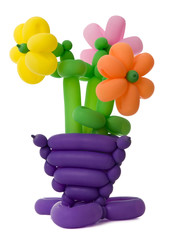 A vase with flowers made of twisted balloons