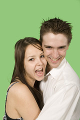 Obraz na płótnie Canvas happy couple close up smiling over green screen