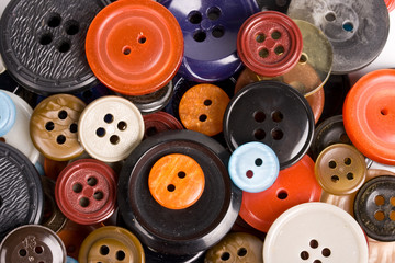 Pile of buttons close up background
