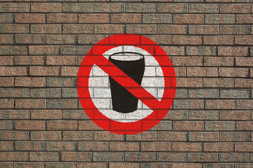 No Alcohol sign painted on brick wall