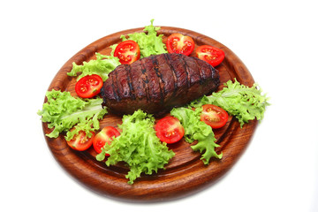 served roasted beef meat steak on wooden plate